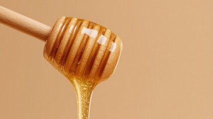 Golden honey flows from a wooden dipper, showcasing its thick texture. The dipper holds the sticky sweetness, complementing the soft beige background that highlights its rich color.