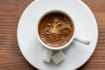 Fototapeta premium Close-Up of Turkish Coffee with Sugar Cube