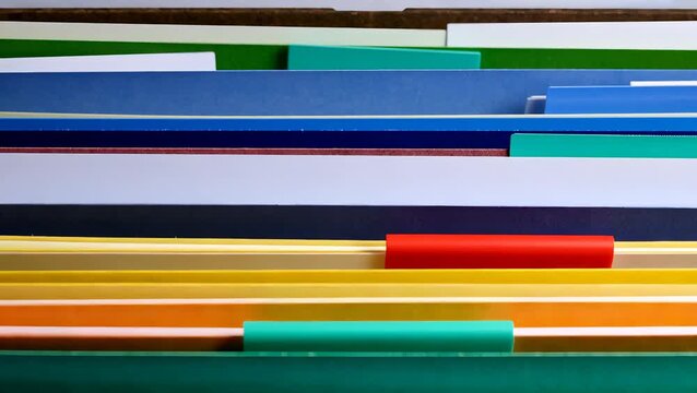 Organized Colorful File Folder Arrangement for Efficient Office Work