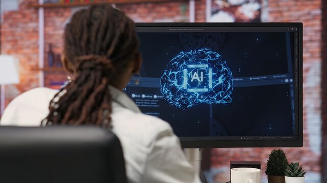 Programmer using computer at home for artificial intelligence computing simulating human brain through self learning algorithms. Employee working with AI deep neural networks on desktop PC, camera B