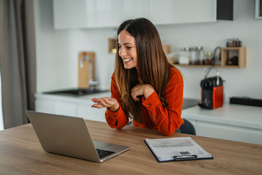 Woman freelancer working from home having a video call - Powered by Adobe
