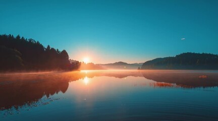 Tranquil lake reflecting mountains and trees under a serene blue sky at dawn with soft fog creating a peaceful and calming scene - Powered by Adobe