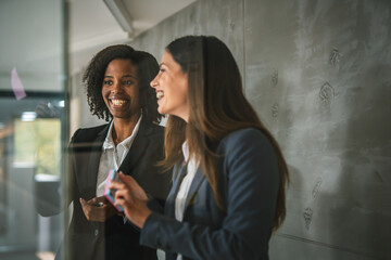 Businesswomen collaborating on ideas during office meeting