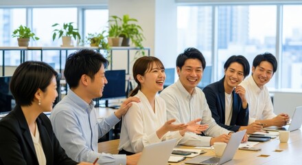 Group of cheerful colleagues engaged in a lively discussion during an office meeting
