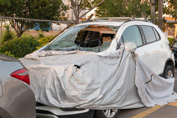 front of a broken car on the road