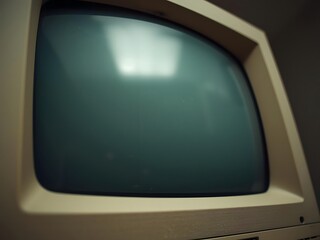 Old beige CRT computer monitor with thick frame and retro tech charm, isolated neatly.