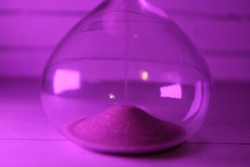 Hourglass as symbol of passing time concept photo	