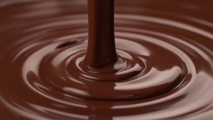 Warm chocolate forming silky movement creating delicious rich texture