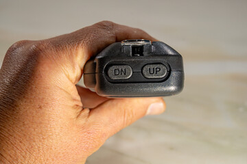 Handheld PTT with CB radio channel change buttons on channel 40.