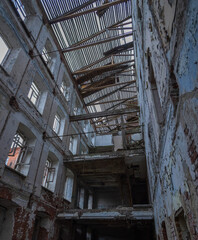 Large, empty building with a lot of damage