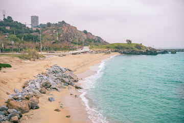 Beach with a rocky shoreline and a blue ocean