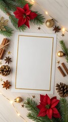 Obraz premium Modern Christmas flat lay with gold-bordered blank space, balanced pine sprigs, red poinsettias, matte gold ornaments, cinnamon, cones, and warm lights on textured paper over light wood 