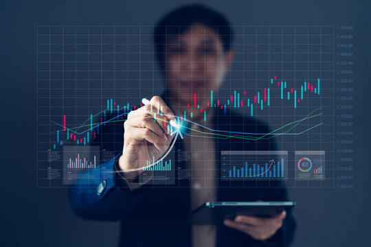 Financial market growth and stock trading data analysis concept with businessman tracking rising candlestick chart