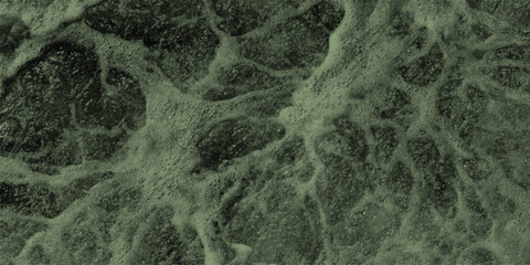 Abstract close-up of turbulent green water surface with foamy bubbles and swirling patterns, creating a dynamic and organic texture for natural or environmental themes