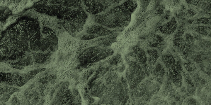 Abstract close-up of turbulent green water surface with foamy bubbles and swirling patterns, creating a dynamic and organic texture for natural or environmental themes