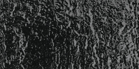 Dark, textured surface with a glossy, undulating pattern and deep shadows, resembling molten metal or a rough, wet material for dramatic and abstract backgrounds