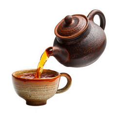 teapot pouring tea into cup on white background.