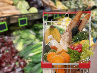 Shopping cart full of products in supermarket