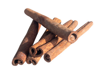 a pile of cinnamon sticks on a white background