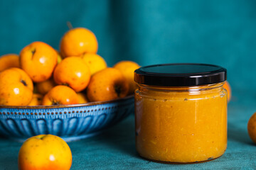 Homemade hawthorn jam jar with fresh fruits, tejocote