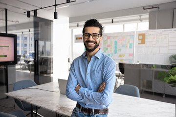 Happy handsome business project manager man posing for portrait