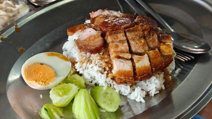 Rice with crispy and barbecued red pork.
