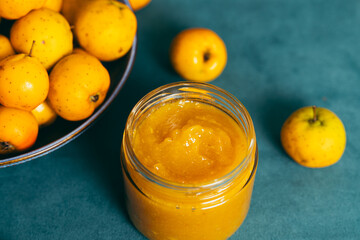 Crabapple jam in glass jar with fresh fruit