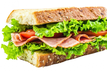 A fresh and delicious sandwich made with whole grain bread. layered with crisp lettuce. juicy tomatoes. and slices of ham. a healthy meal option perfect for lunch or a picnic