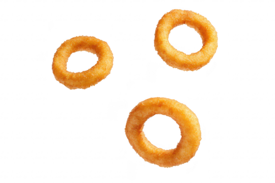 Three golden-brown onion rings floating against a white background. their crispy texture and circular shape. ideal for food advertisements or culinary presentations - Powered by Adobe