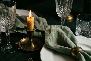 Luxury Holiday Table Setting with Beeswax Candle and Sage Linen