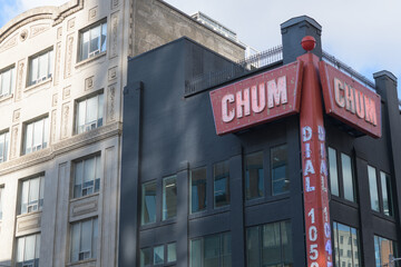 Fototapeta premium vintage neon sign of CHUM 104.5 located at 299 Queen St W (installed at northwest corner of Richmond and Duncan), Toronto