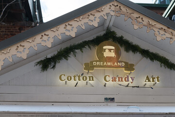 Fototapeta premium detail of Dreamland Cotton Candy, a holiday cabin at Toronto’s Distillery District Winter Village, serving whimsical cotton candy art shaped into fun designs