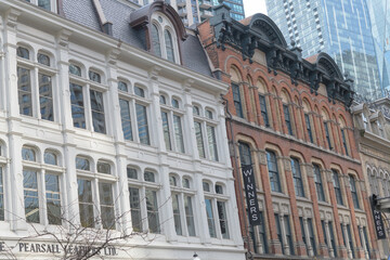 Fototapeta premium facade and signs on the exterior of Dixon Block/Griffiths Building/Block located at 45, 47, 49 Front St E, Toronto