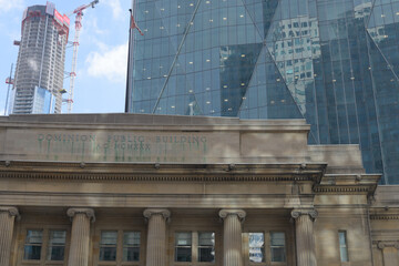 Fototapeta premium contrast of Dominion Public Building (1 Front St) and CIBC Square, North Towers (141 Bay St), Toronto