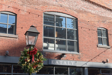 Fototapeta premium exterior building facade and sign of Eataly located at 21 Trinity St, The Distillery Historic District, Toronto