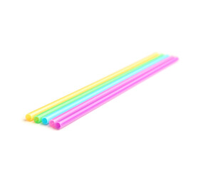 Different plastic straws on white background