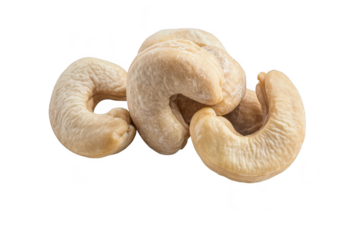 A close-up view of raw cashew nuts arranged on a white background. their unique shapes and textures. ideal for culinary uses or health-focused articles