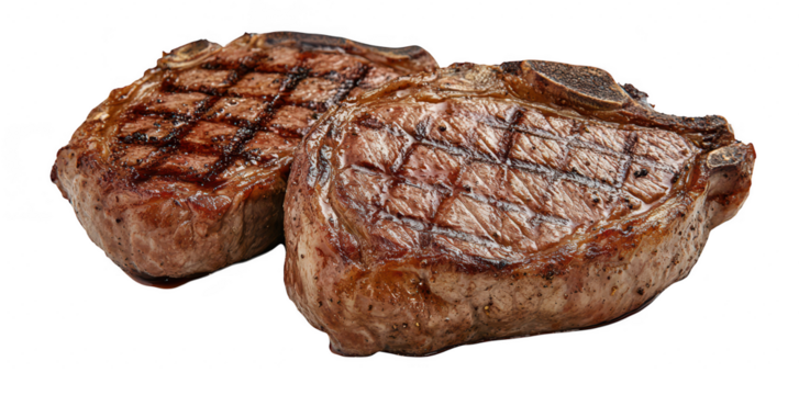 Two perfectly grilled pork chops with a rich brown crust and distinct grill marks. placed on a clean white background. ideal for culinary presentations or food-related content