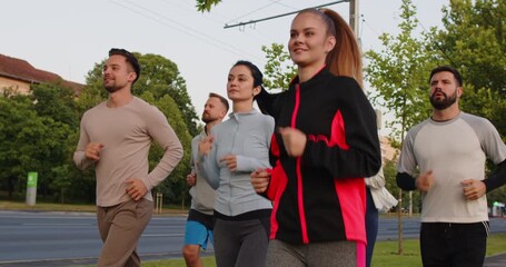 United athlete team jogging together outdoors during training, boosting running workout, uniting in run effort, enhancing fitness sport activity, engaging in jog with fitness focus.
