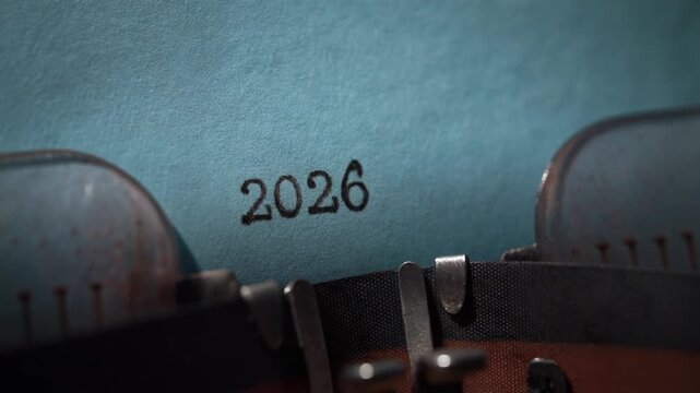 Typewriter Typing the Year 2026 on Blue Paper for Future Concepts