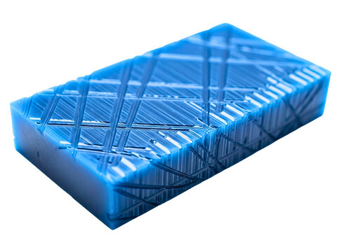 Blue rectangular soap bar with scratched geometric patterns on a transparent background