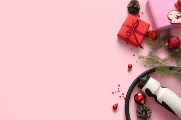 Obraz premium Composition with sports equipment, Christmas gift and decorations on pink background