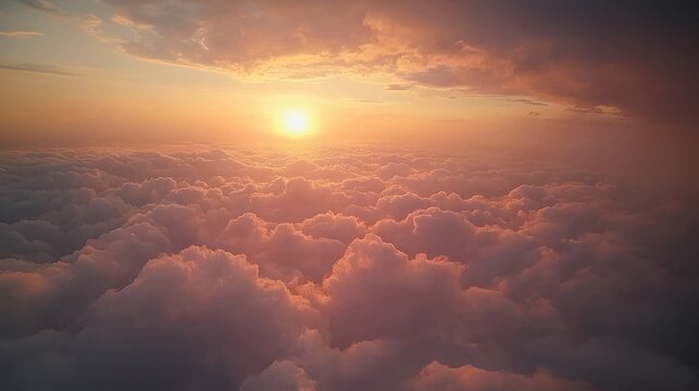 Golden sunrise over a sea of soft pink and orange clouds, peaceful and awe inspiring sky above the horizon