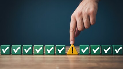 Human finger touches a solitary warning block interrupting a sequence of approved checklist items