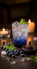 Obraz premium Refreshing Blueberry Mint Drink with Ice and Candlelight