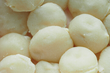 Soft dough balls ready for baking in the kitchen