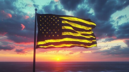 American flag waving on a pole over the ocean at vibrant sunset with dramatic clouds and warm glowing light