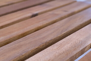 Natural brown wooden plank background with parallel lines. close up on wood grain texture showing simple, clean, abstract pattern, perfect for floor or furniture design