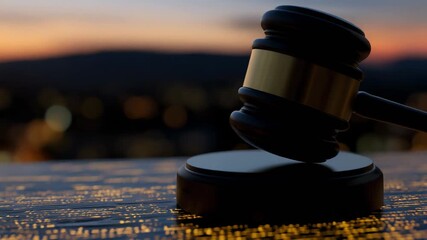 Elegant gavel on legal documents with vibrant city lights background for law and justice themes
