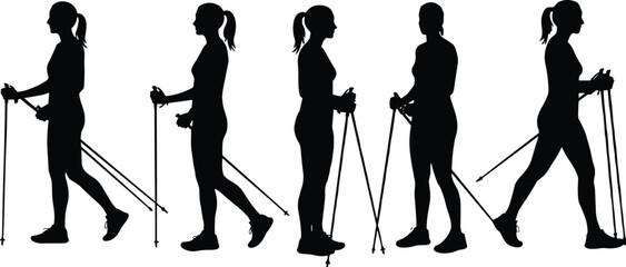 Obraz premium Silhouette of women Nordic walking — group exercise with poles, fitness outdoor activity, healthy lifestyle, female walkers in motion